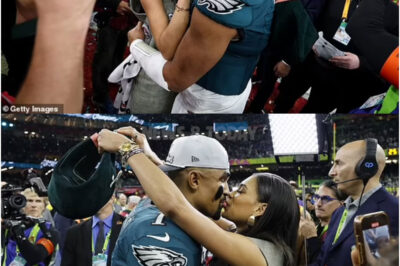 The NFL’s new power couple? Jalen Hurts shares a romantic moment with fiancee Bry Burrows on the field