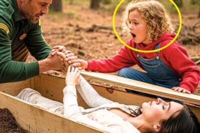 The midday sun filtered through the pine branches as Logan Hartley and his six-year-old daughter Mia explored the forest trail. A perfect father-daughter hike until Mia suddenly froze. Her head tilted to one side. Daddy, someone’s knocking. She whispered, pointing at a freshly disturbed patch of earth just off the trail. Under there, Logan listened. At first, nothing.