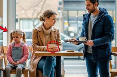 The winter wind howled outside the small cafe in downtown Chicago, carrying with it the faint hum of car horns and the scent of roasted coffee beans drifting from the cozy warmth within. Inside, near the window, a young woman sat quietly with her little girl. Her coat was worn, the fabric faded from too many seasons of survival, and her eyes, tired but gentle, watched the snowflakes fall beyond the glass.